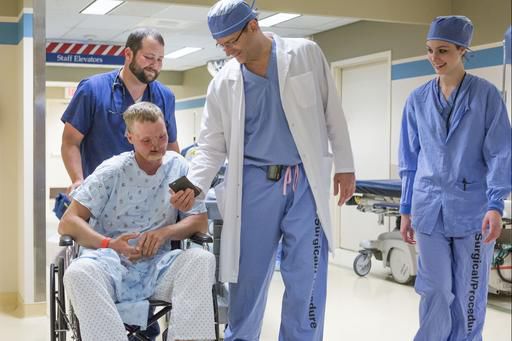 AP Exclusive: Twin tragedies give survivor a new face